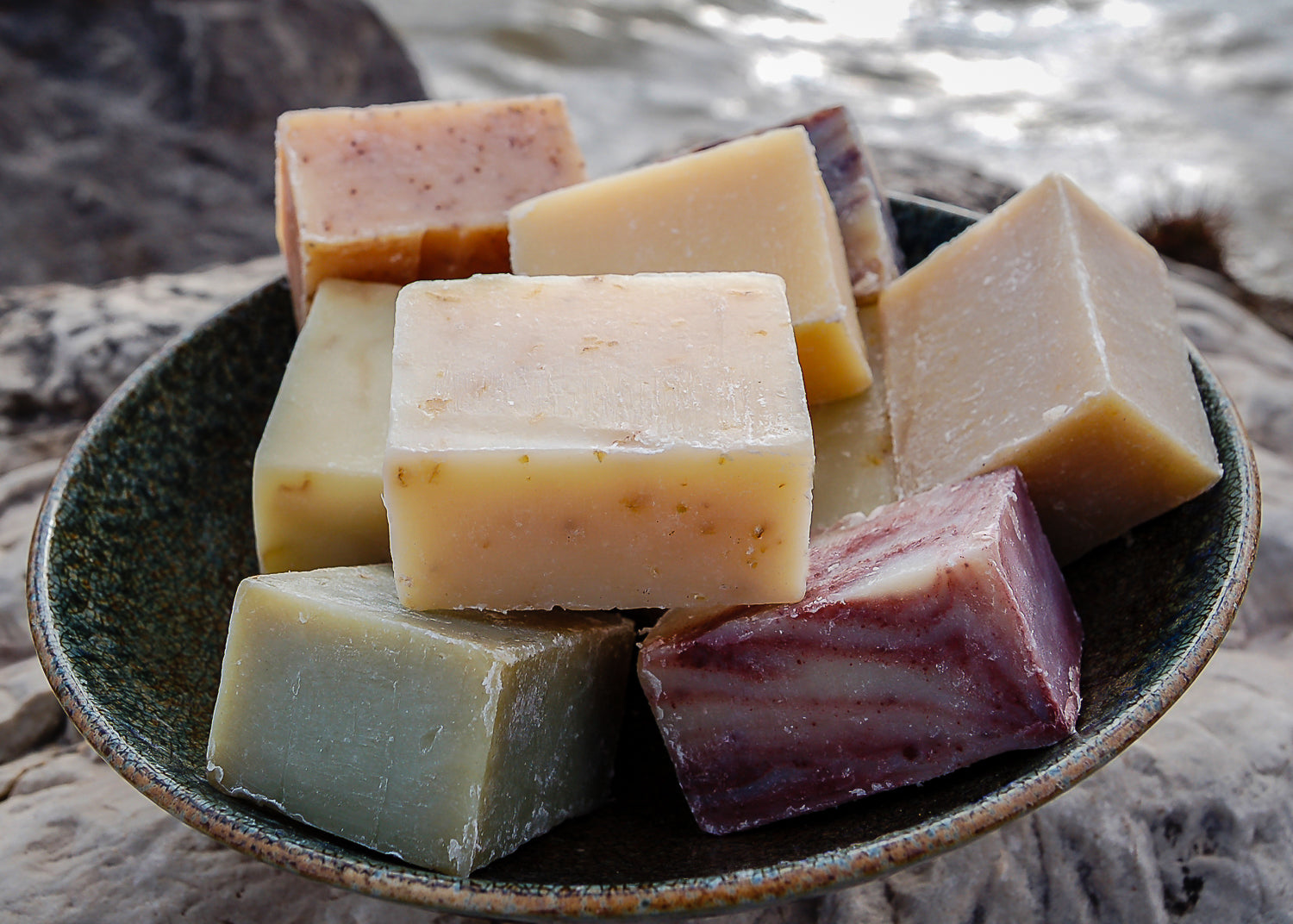 photo of several bars of natural handmade soap in a bowl